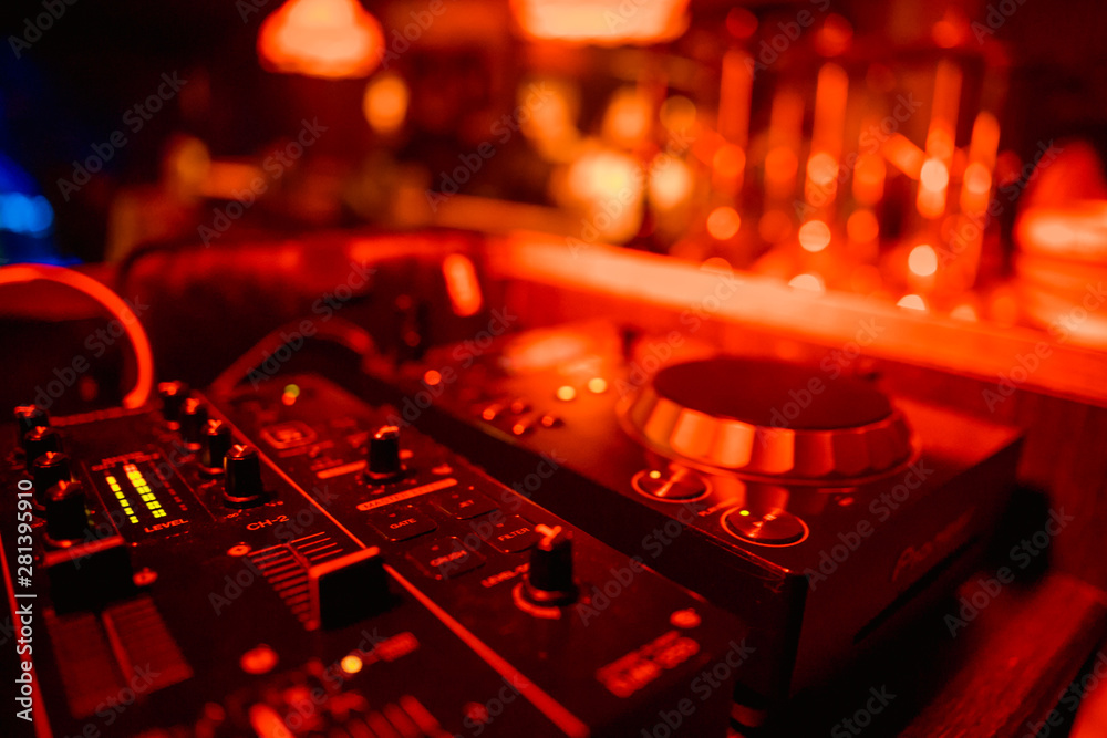 DJ playing music on light background - obrazy, fototapety, plakaty 