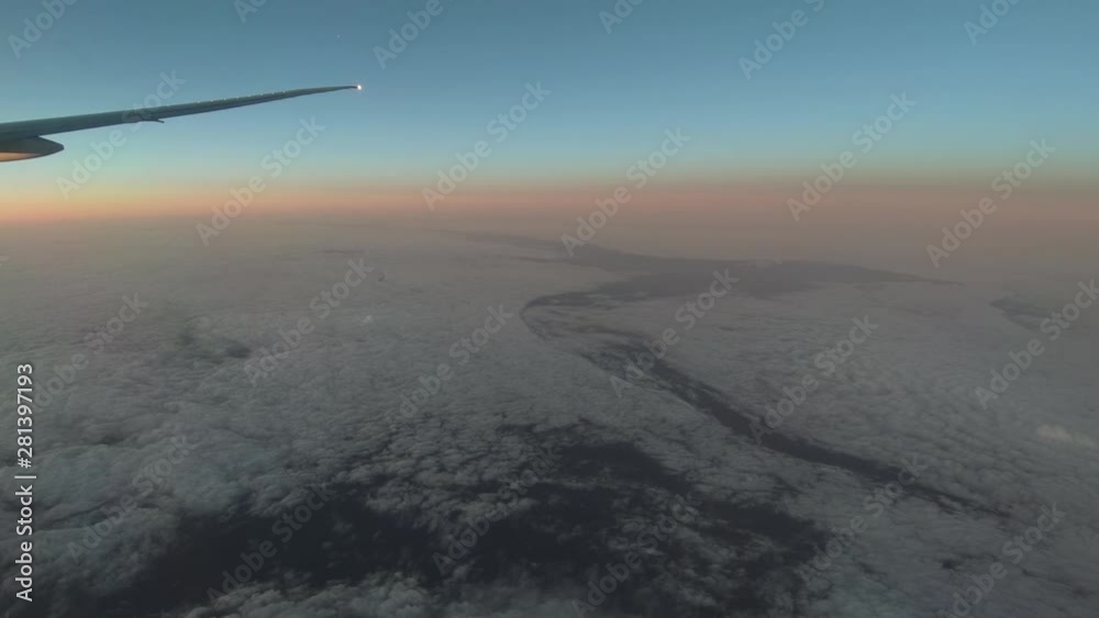 Jet plane sunrise view out of window over the Atlantic ocean Jet plane sunrise view out of window over the Atlantic ocean