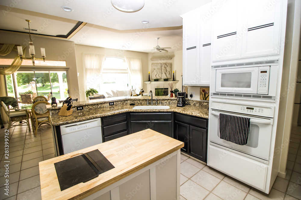 Modern Kitchen With Built-In Appliances And Granite Counter Bar Modern Kitchen With Built-In Appliances And Granite Counter Bar