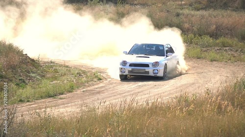 Rally Car Driving on a Dusty Road. Slow Motion