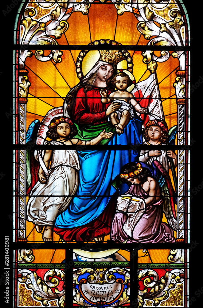 Virgin Mary with baby Jesus and Angels, stained glass window in the Saint John the Baptist church in Zagreb, Croatia