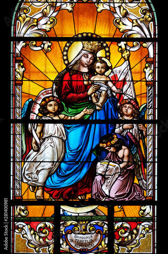 Virgin Mary with baby Jesus and Angels, stained glass window in the Saint John the Baptist church in Zagreb, Croatia