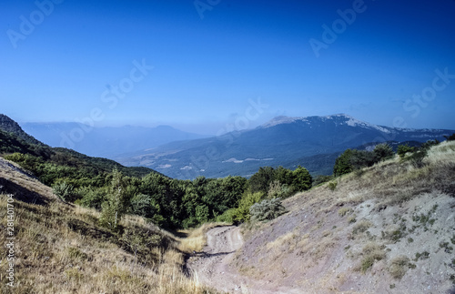 The mountains with a cloud overhead.Landscape of mountains and rocks. Green nature of stone mountain. Natural beauty. Nature of Crimea. Ukraine