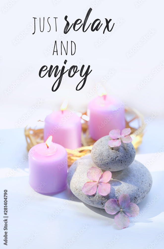 Just relax and enjoy - motivation quote. candles, flowers hydrangea, spa stones. Spa therapy composition. Ritual for relaxation, meditation. Gentle spa and wellness background Just relax and enjoy - motivation quote. candles, flowers hydrangea, spa stones. Spa therapy composition. Ritual for relaxation, meditation. Gentle spa and wellness background