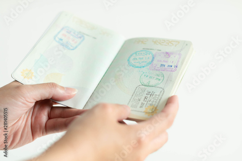 Wallpaper Mural hands is holding passport with immigration stamp inside. Torontodigital.ca