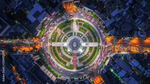 Aerial top view traffic road roundabout in city at night, Time lapse top road in bangkok. photo
