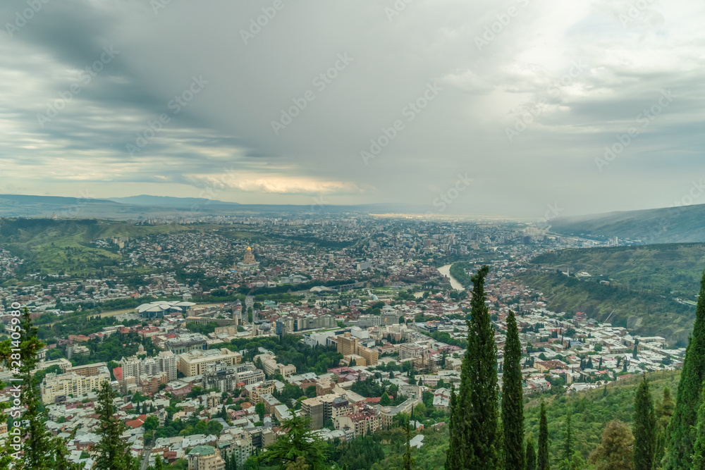 Panoramic view of Tbilisi from Mount Mtatsminda on a cloudy day, Georgia