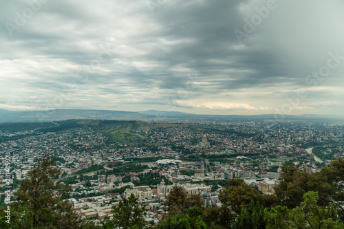 Fototapeta Naklejka Na Ścianę i Meble -  Panoramic view of Tbilisi from Mount Mtatsminda on a cloudy day, Georgia