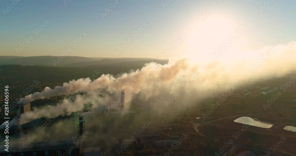 Aerial. Smokestacks of metallurgical plant at sunset. Air Pollution Concept. Aluminum production. Top view. Shelehov, Irkutsk, Russia Aerial. Smokestacks of metallurgical plant at sunset. Air Pollution Concept. Aluminum production. Top view. Shelehov, Irkutsk, Russia