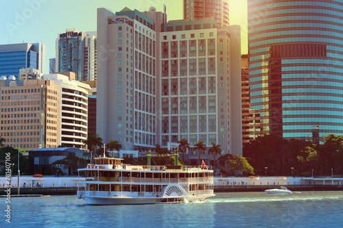 Skyscrapers at the Brisbane river with with paddle wheel boat in front, Australia