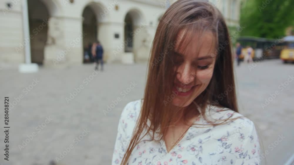 Outdoor portrait appealing sexy young woman smiling walking down the beautiful city. Close-up passionate brunette girl having good time in the town center on sunny day. Outdoor portrait appealing sexy young woman smiling walking down the beautiful city. Close-up passionate brunette girl having good time in the town center on sunny day.