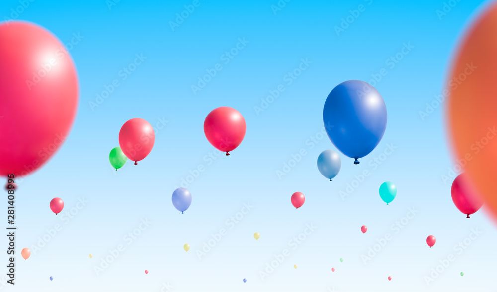 Colored inflatable balloons take off. Clear sky in the background.