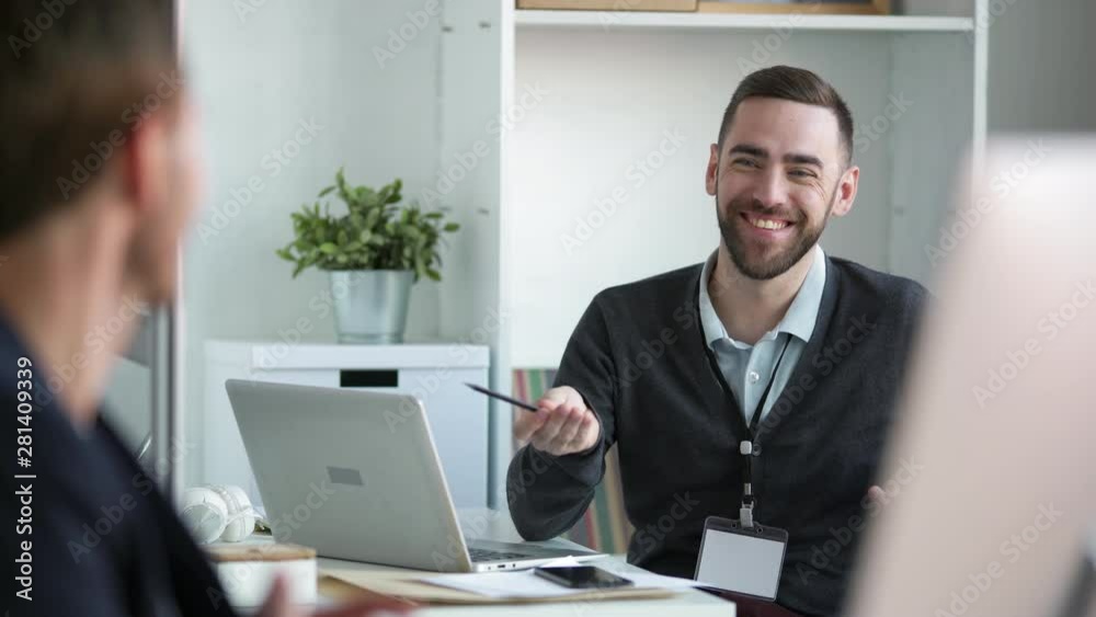 Lockdown of male employer interviewing candidate for vacancy sitting in front of him
