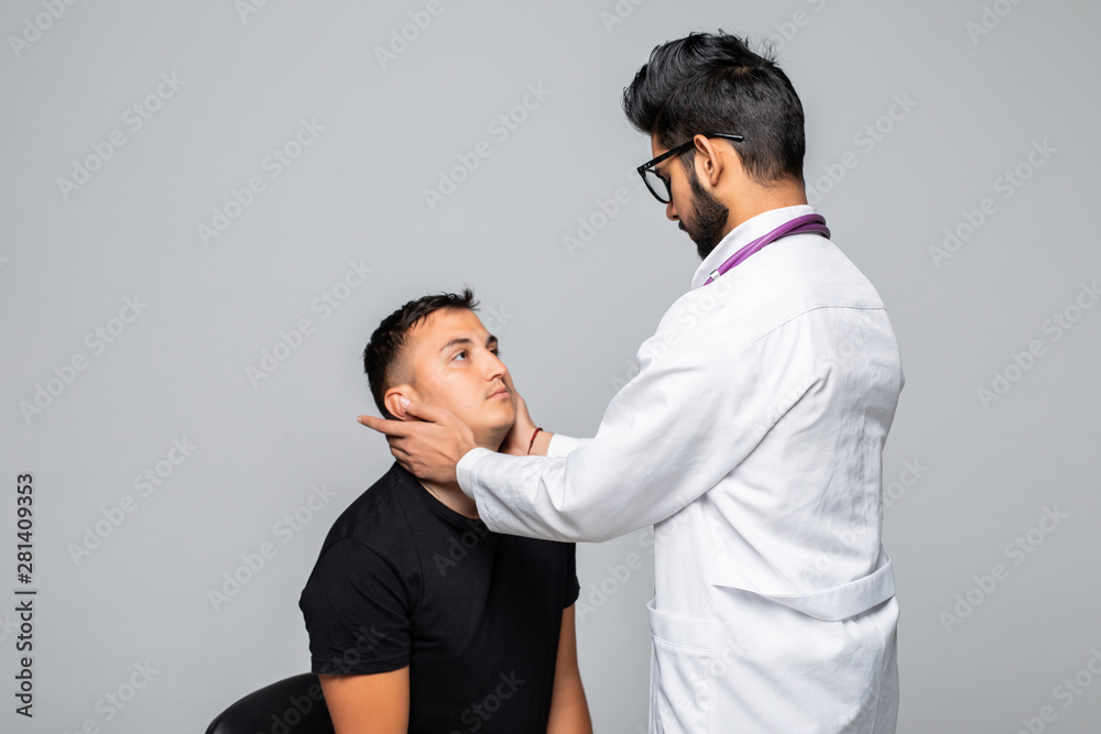 Medicine, healthcare and people concept - smiling doctor exam patient at hospital Medicine, healthcare and people concept - smiling doctor exam patient at hospital