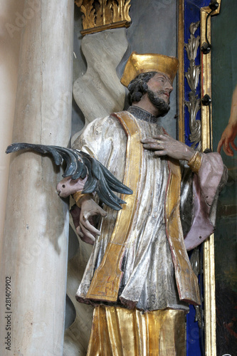 Statue of Saint on the altar of the Saint John the Baptist in the Church of Saint Mary Magdalene in Cazma, Croatia photo