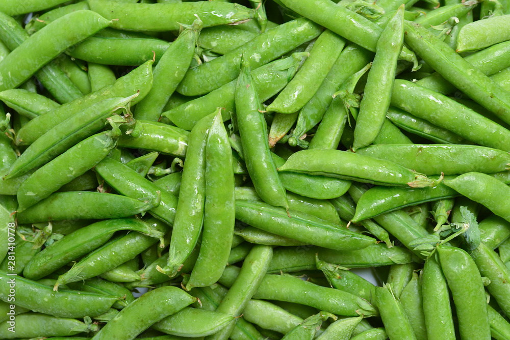 Fresh pea pods as background. Top view. Fresh pea pods as background. Top view.