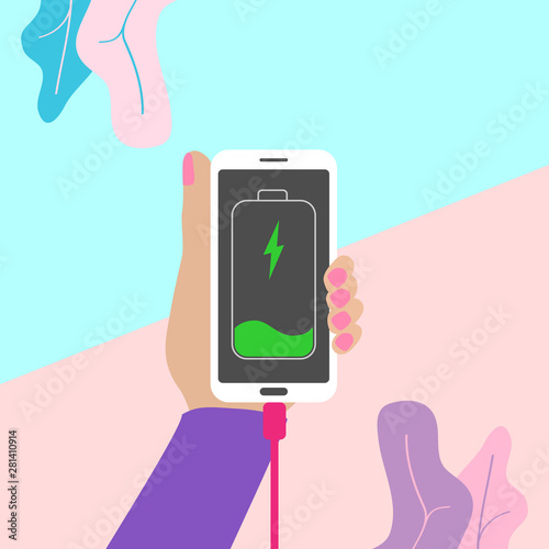 Girl using mobile phone while charging the battery