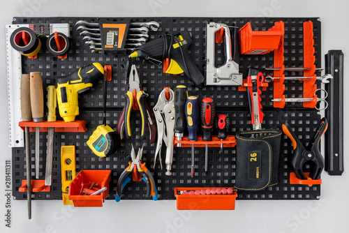 Many different old tools on the wal