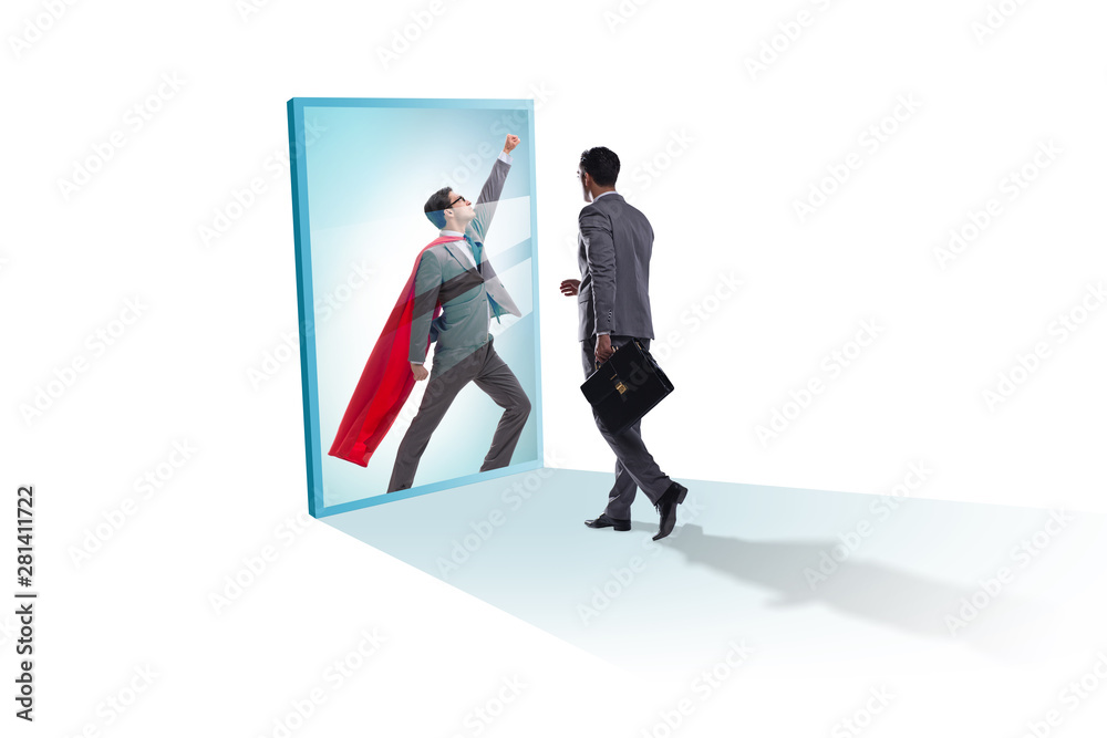 Businessman seeing himself in mirror as superhero Businessman seeing himself in mirror as superhero
