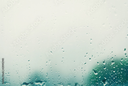 Raindrops on the window, green background