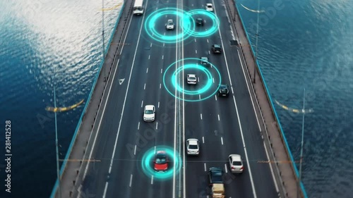 Drone aerial view traffic driving through the bridge to the city. Autopilot self driving cars with visual effects artifical technology showing identity and speed. Future transportation. 4K dolly zoom