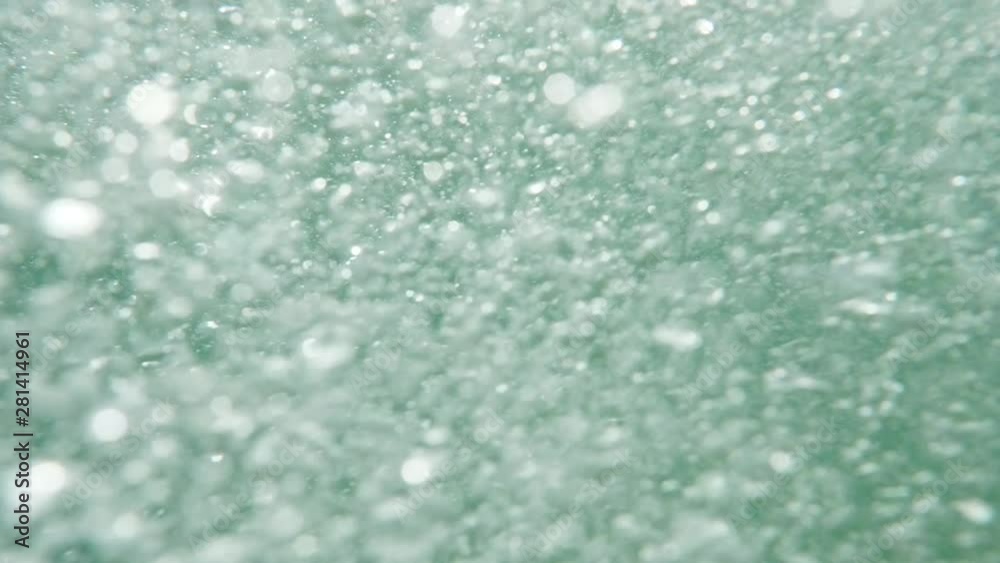 Bubbles rising to the water surface. Slow motion. Air bubbles in clear blue water (underwater shot), good for backgrounds. Bubbles rising to the water surface. Slow motion. Air bubbles in clear blue water (underwater shot), good for backgrounds.
