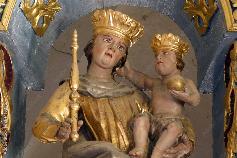 Virgin Mary with baby Jesus, statue on the main altar in the Church of the Three Kings in Komin, Croatia
