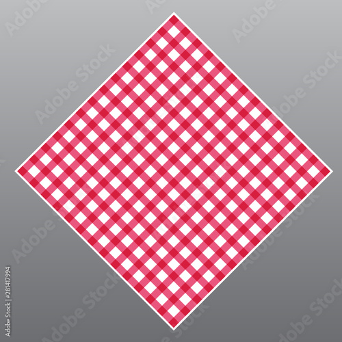 Red checkered tablecloth on table on gray background