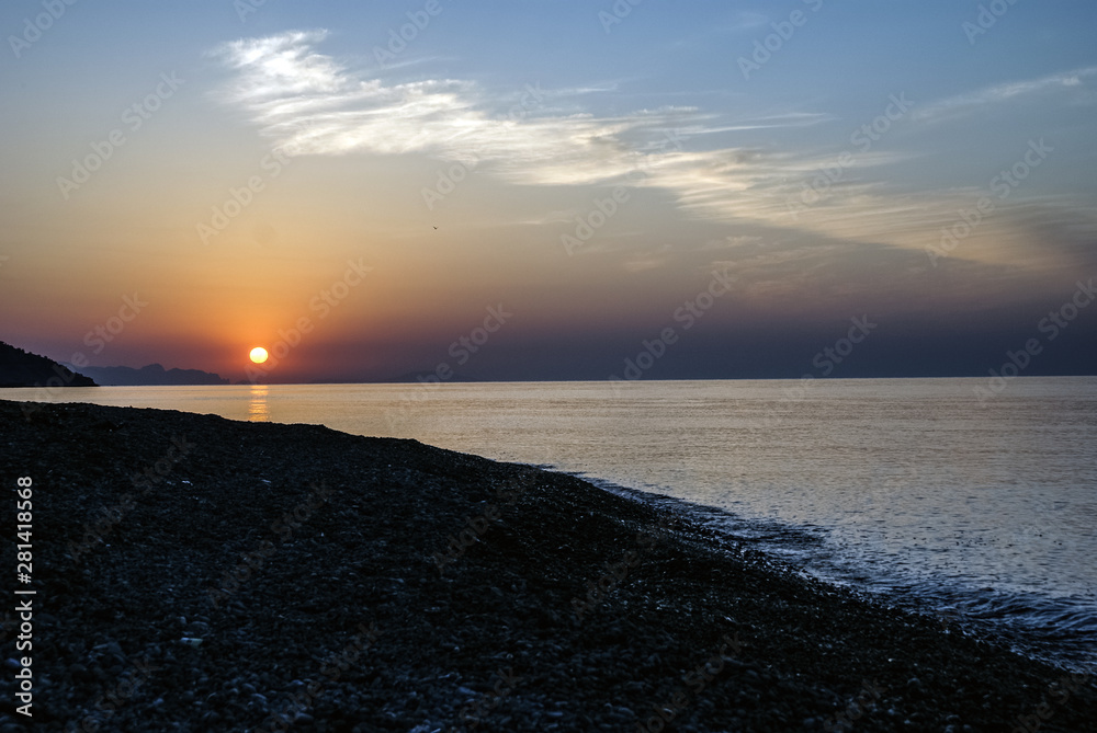 Amazing Sunset by the sea. Beautiful sunset. Mystical background. Golden sunset over the Black Sea. The beauty of the Crimea. Ukraine