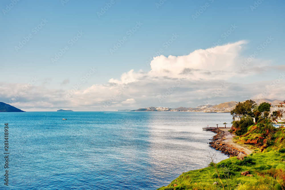 Beautiful seascape and coastline on a bright sunny afternoon in Turgutreis, Bodrum, Turkey.