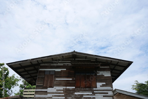 Residential wooden houses and the sky backdrop in Thailand