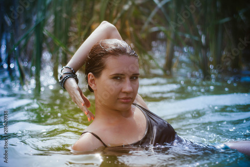 Fototapeta Naklejka Na Ścianę i Meble -  young woman in the water