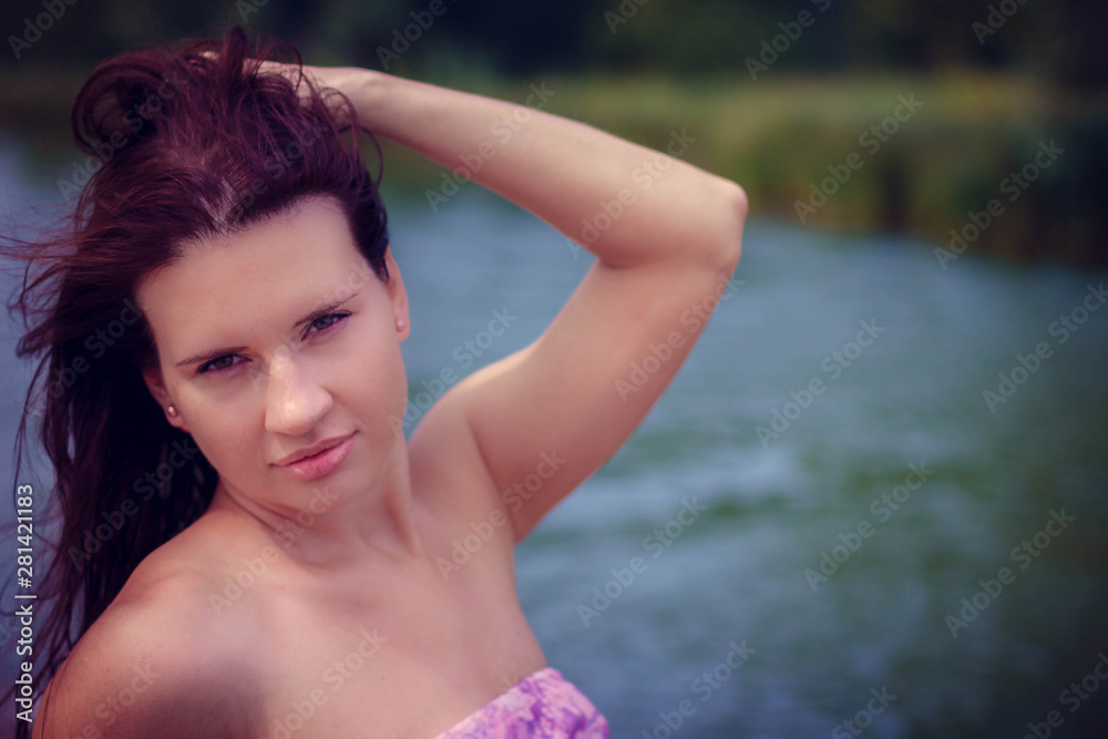 young woman in a purple dress by the lake young woman in a purple dress by the lake