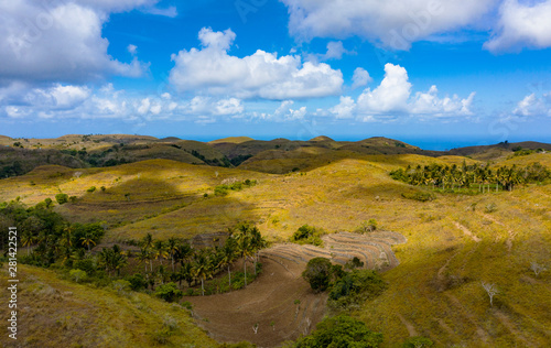 Teletubbies Hill. Drone Shot Tropical Savanna Hills at Nusa Penida, Bali - Indonesia photo