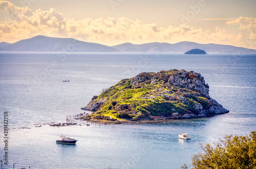 Fototapeta Naklejka Na Ścianę i Meble -  Beautiful landscape view of rabbit island, sea and boats from above in Gumusluk, Bodrum, Mugla, Turkey.