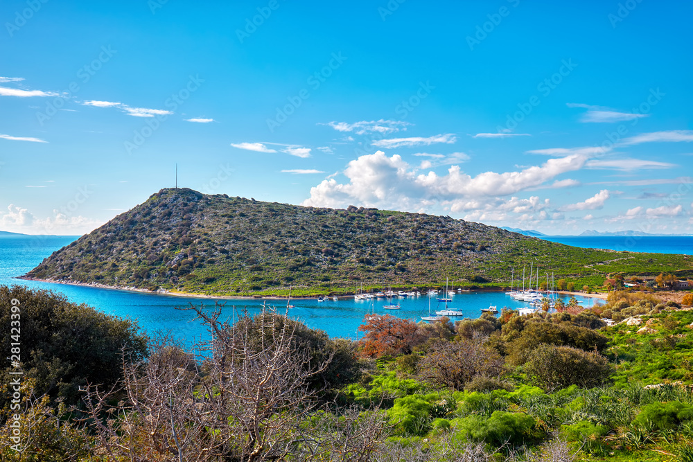 Beautiful landscape view of touristic Gumusluk bay and rabbit island in Bodrum, Mugla, Turkey