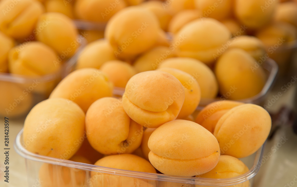 Fresh apricots on the table at the farmer's market counter. Fresh apricots on the table at the farmer's market counter.