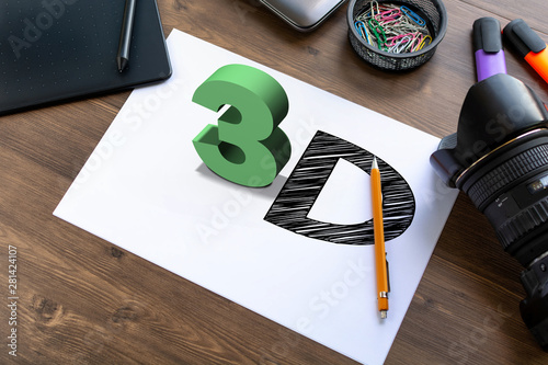 3D text 3D on a sheet of papper on work desk with pen tablet, laptop, camera