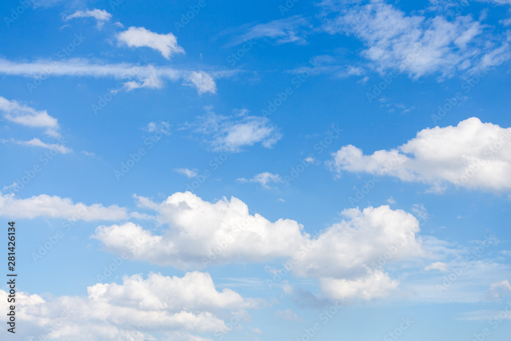 White clouds with blue sky background.