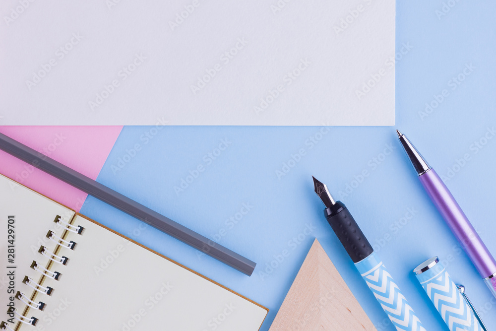 Back to school concept. School stationery and seashell on pink blue background. Pens, pencil and gon on pastel background. Top view. Copy space Back to school concept. School stationery and seashell on pink blue background. Pens, pencil and gon on pastel background. Top view. Copy space