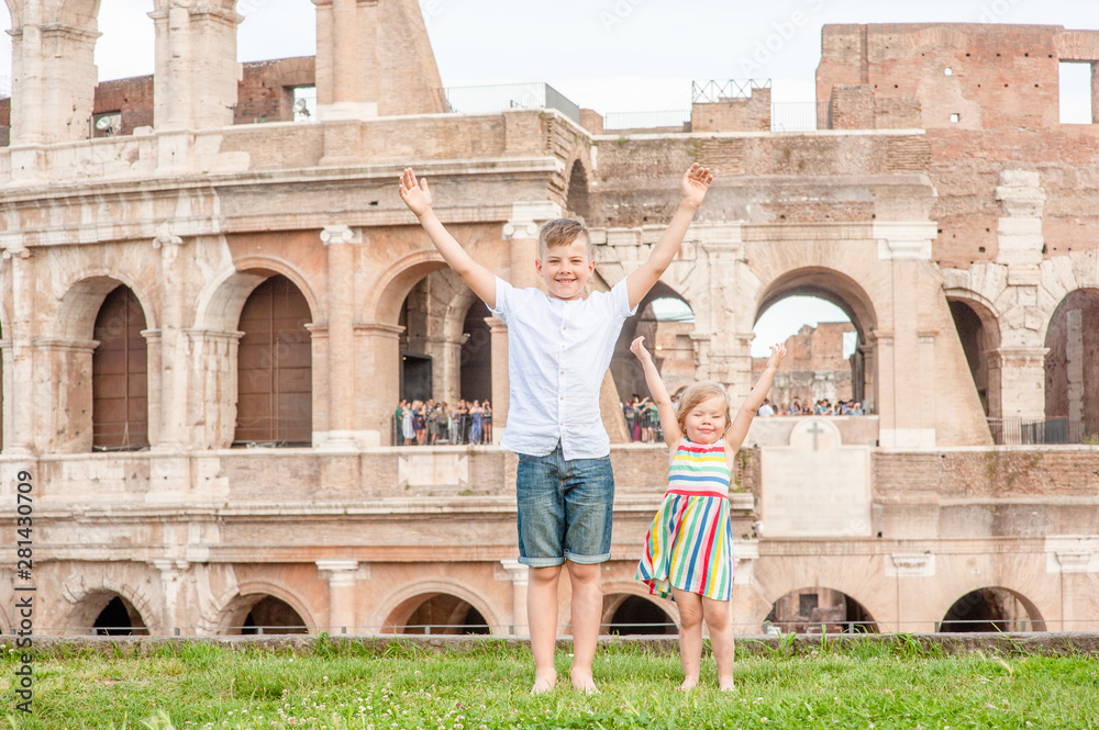 Very happy kids near Coliseum in Rome, Italy. Travel concept