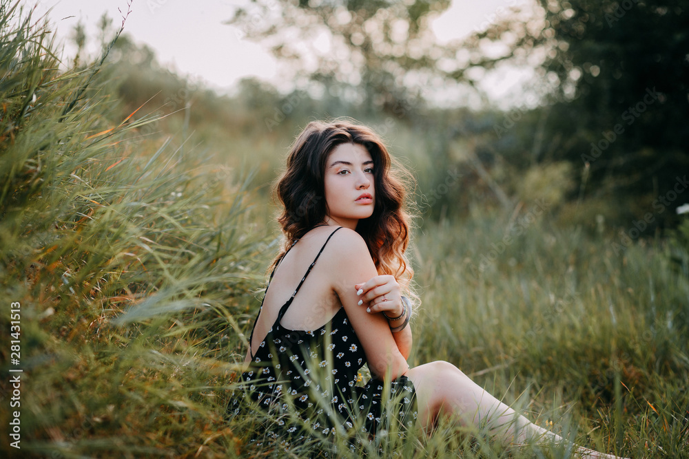 Young girl in harmony in the summer nature Young girl in harmony in the summer nature