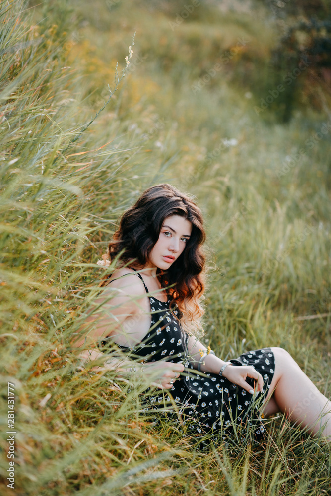 Young girl in harmony in the summer nature Young girl in harmony in the summer nature
