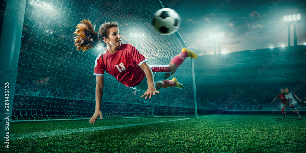 Female Soccer player in action on a professional soccer stadium. Girl