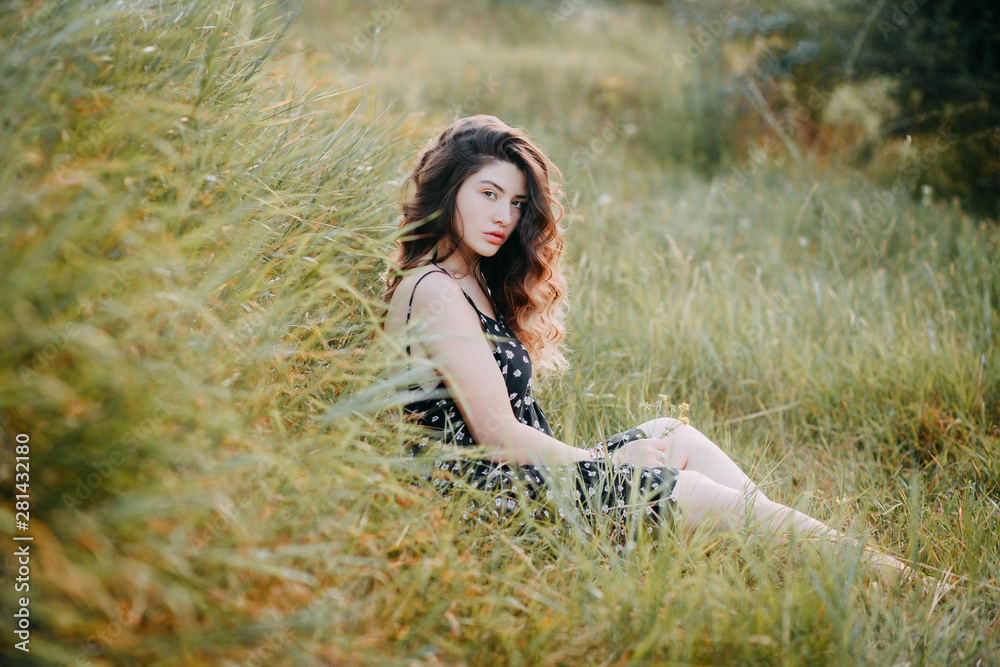Young girl in harmony in the summer nature Young girl in harmony in the summer nature