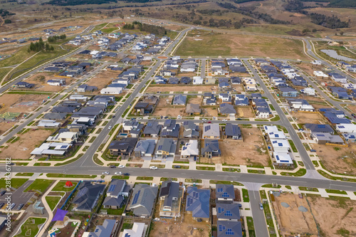 Aerial view of streets, houses and housing development in the newly established suburb of Denman Prospect in Canberra, Australia