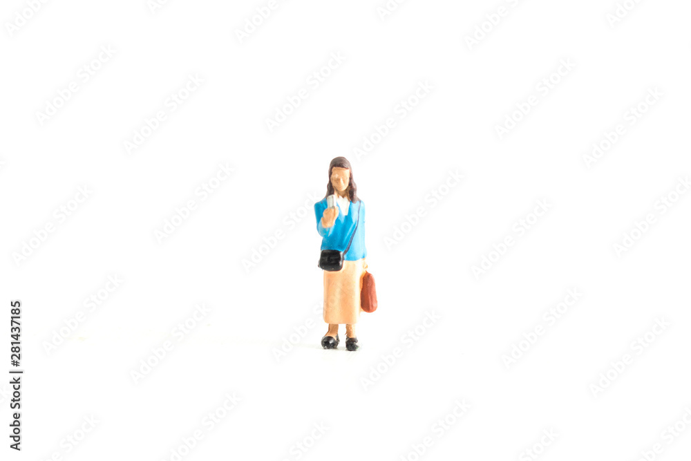 Miniature Person using a Phone Dressed in Blue Standing on a White Isolated Background