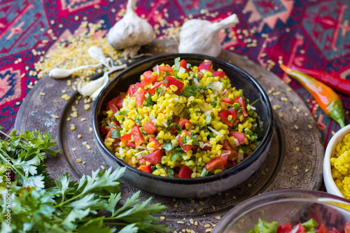 Tabbouleh - Arabic salad with bulgur and couscous, parsley, tomatoes, onion, lemon. 