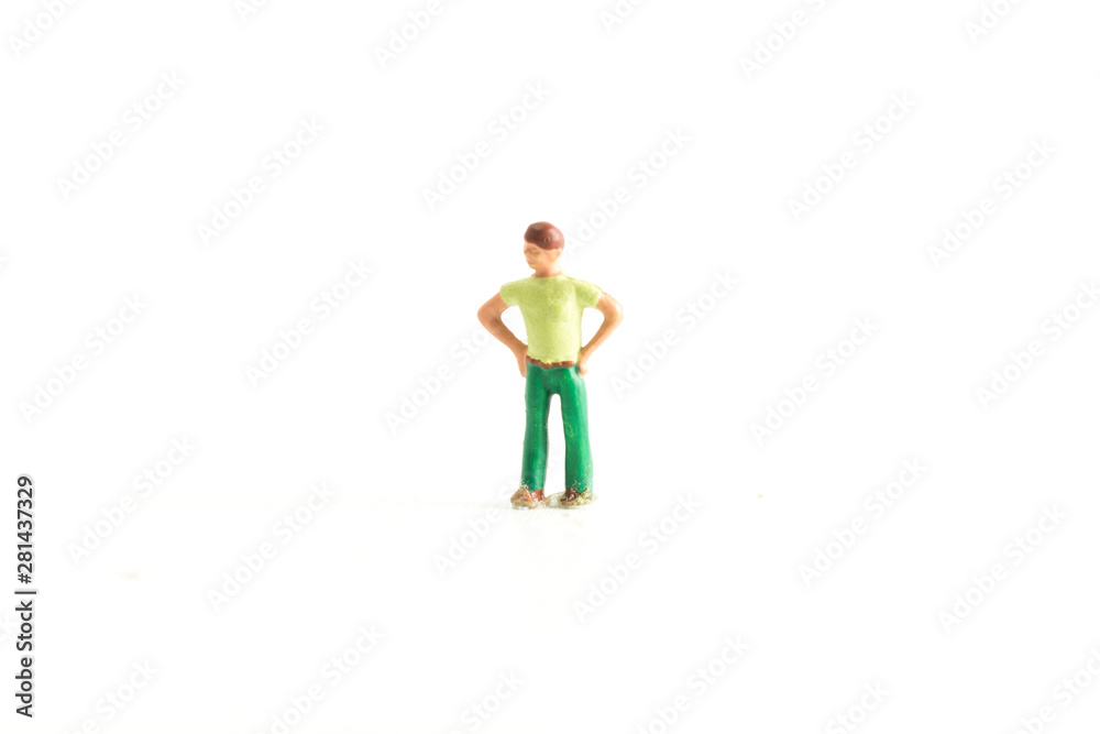 Miniature person with there hands on there hips on a white isolated background