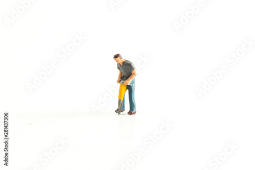 Iconic Image of a Miniature Construction Worker using a Jack Hammer/Drill
